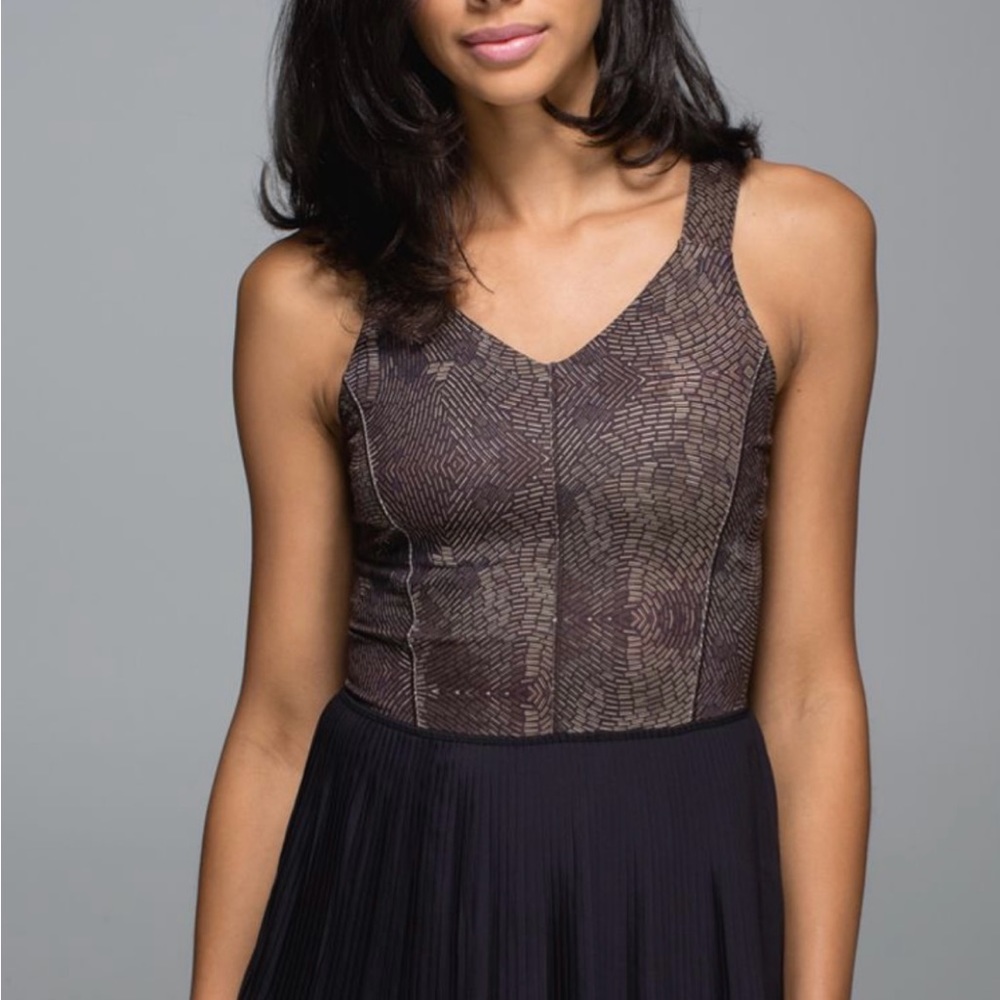 Women’s new with tags Lululemon city tank in a gold/black pattern. Size 12